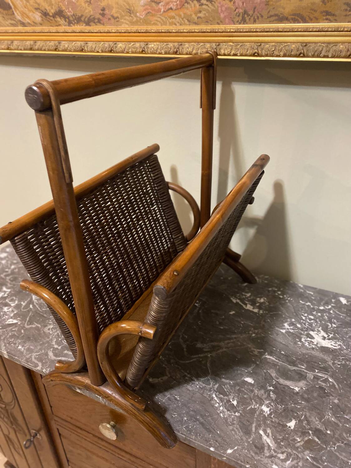 Wicker and brown wood magazine rack
