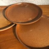 4 flat plates in raw sandstone