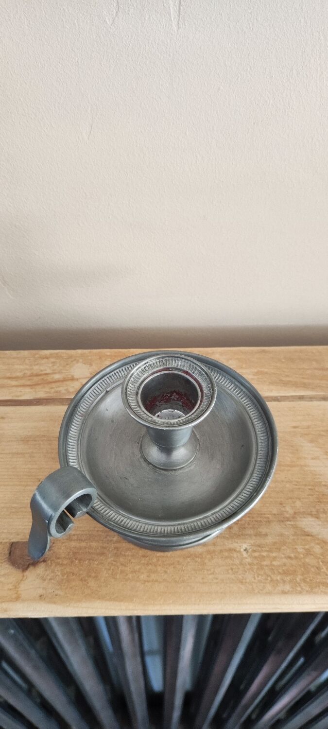 Tin hand candle holder.