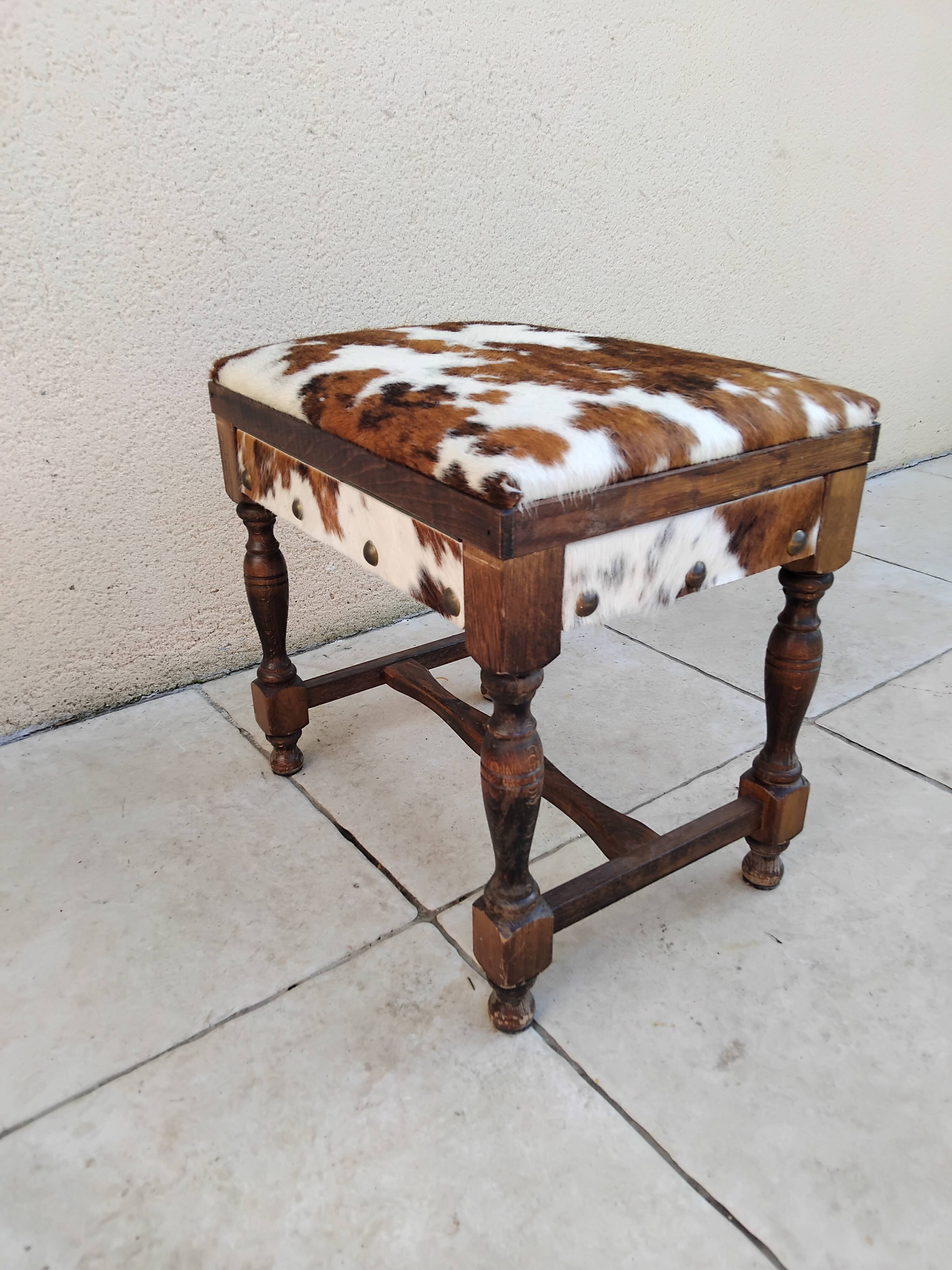 Vintage cowhide trunk stool