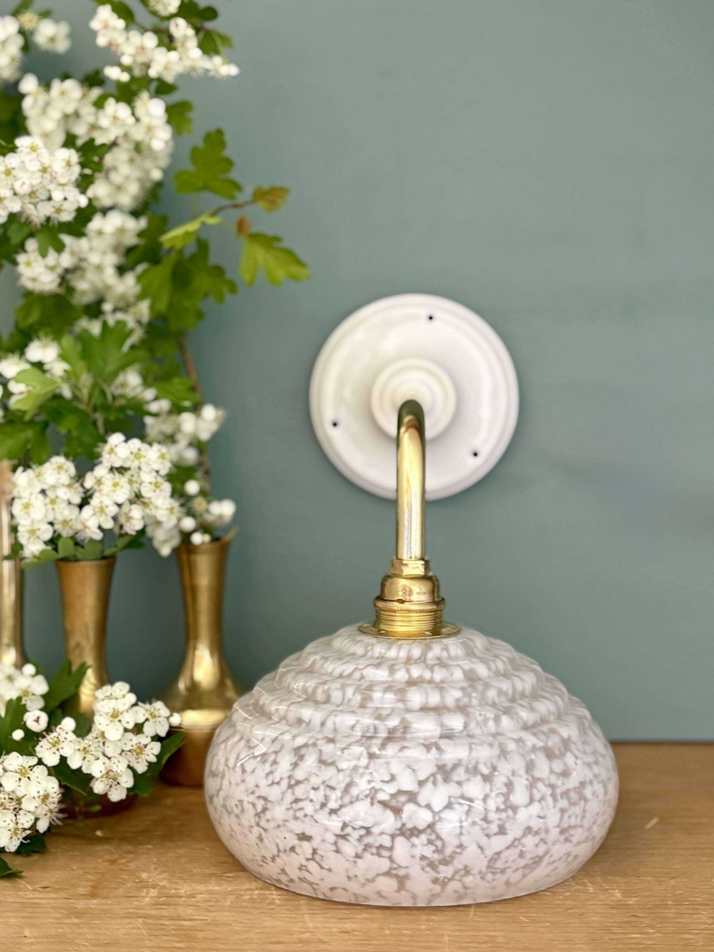 Vintage glass wall lamp with a white Clichy shade.