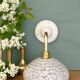 Vintage glass wall lamp with a white Clichy shade.