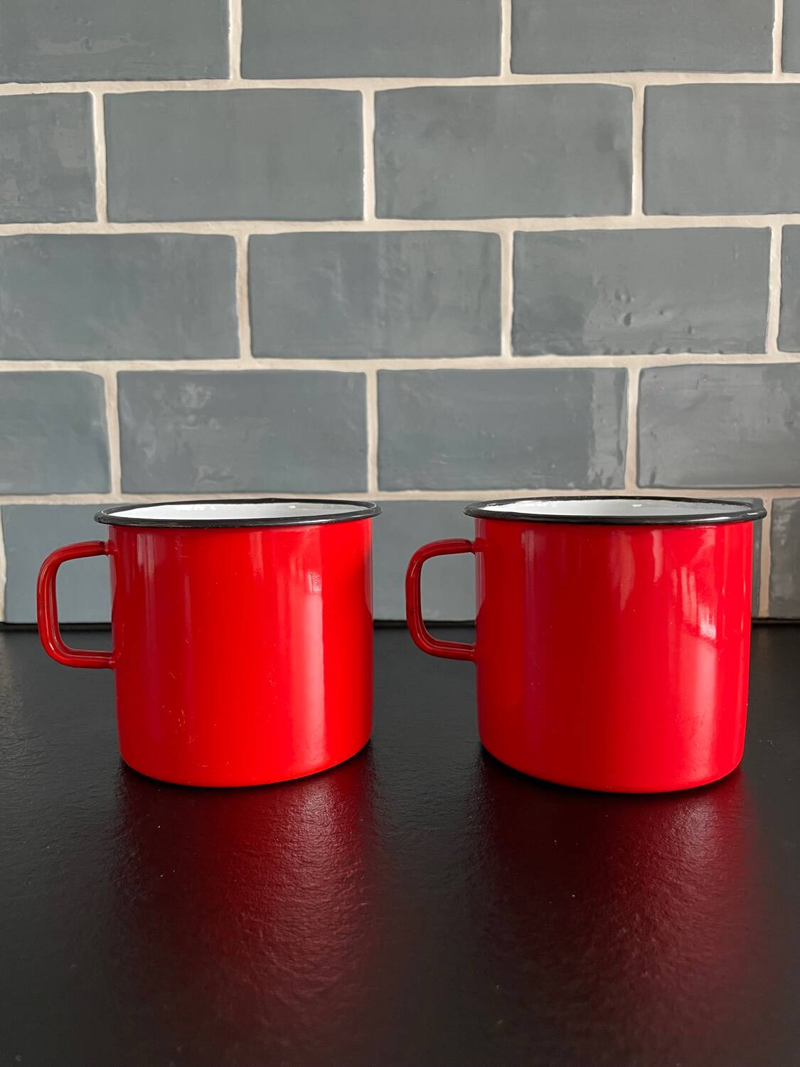 Red enameled sheet metal mug
