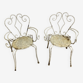 Pair of wrought iron armchairs