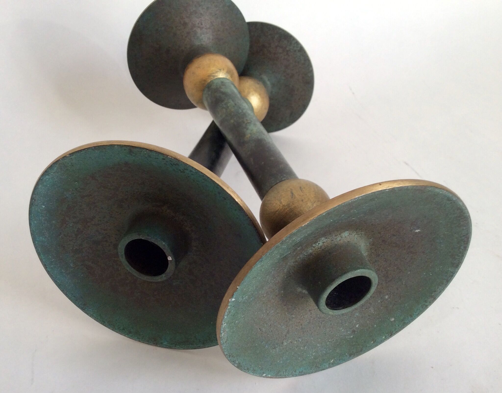 Pair of patinated bronze candlesticks