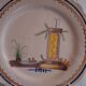 Plate dish with scalloped edges in Nevers earthenware in good condition from the 18th century.