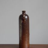 Enamelled brown sandstone bottle with handle