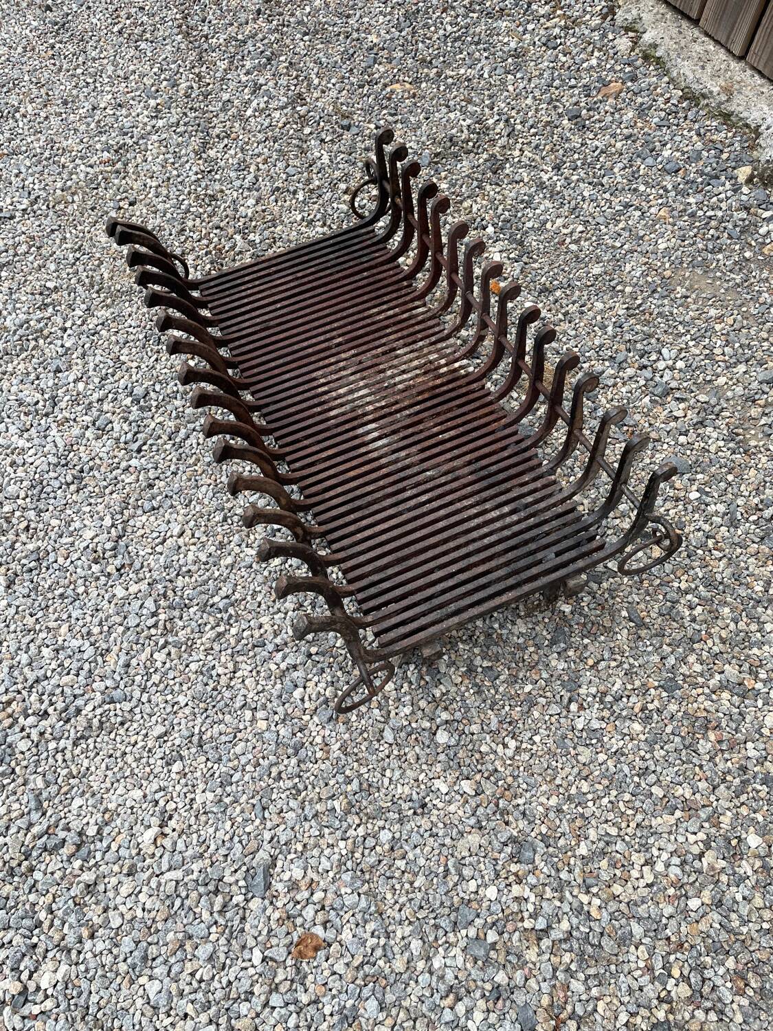 Vintage cast iron fireplace cradle with 16 bars.