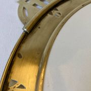 Art Nouveau plate in earthenware with a brass frame