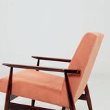 Mid-century modern armchair in coral red designed by H. Lis.