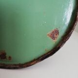Green broc in enamelled sheet metal with floral patterns