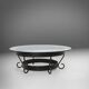 Rustic round coffee table with wrought iron base and glass top, France, 1930s