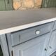 Robust country sideboard with country charm with marble handles in gray and white chalk