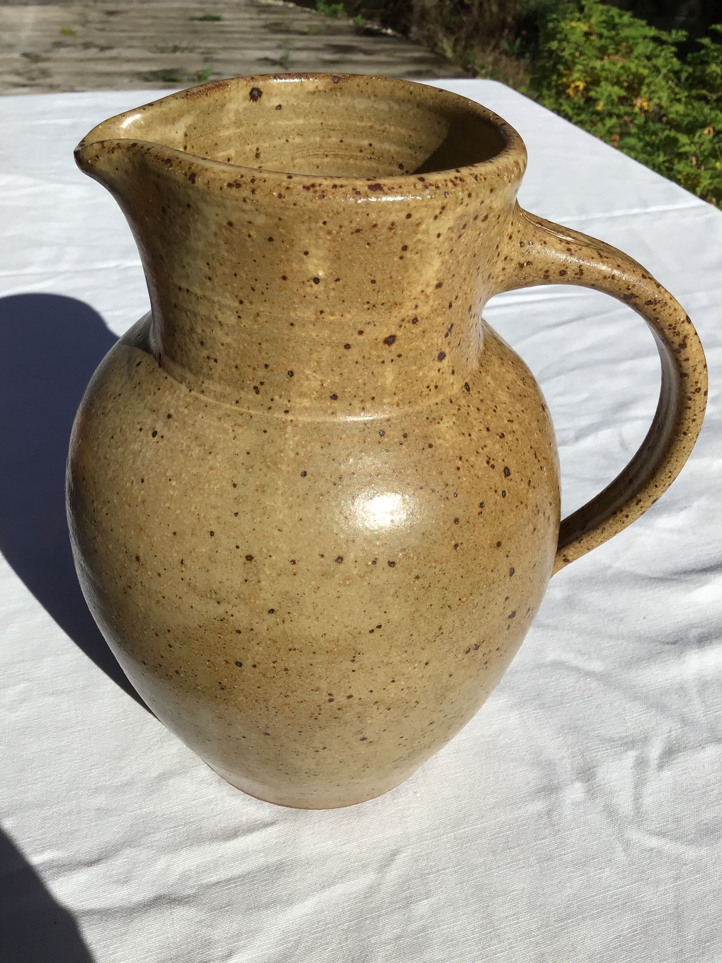 Beige handcrafted speckled sandstone pitcher