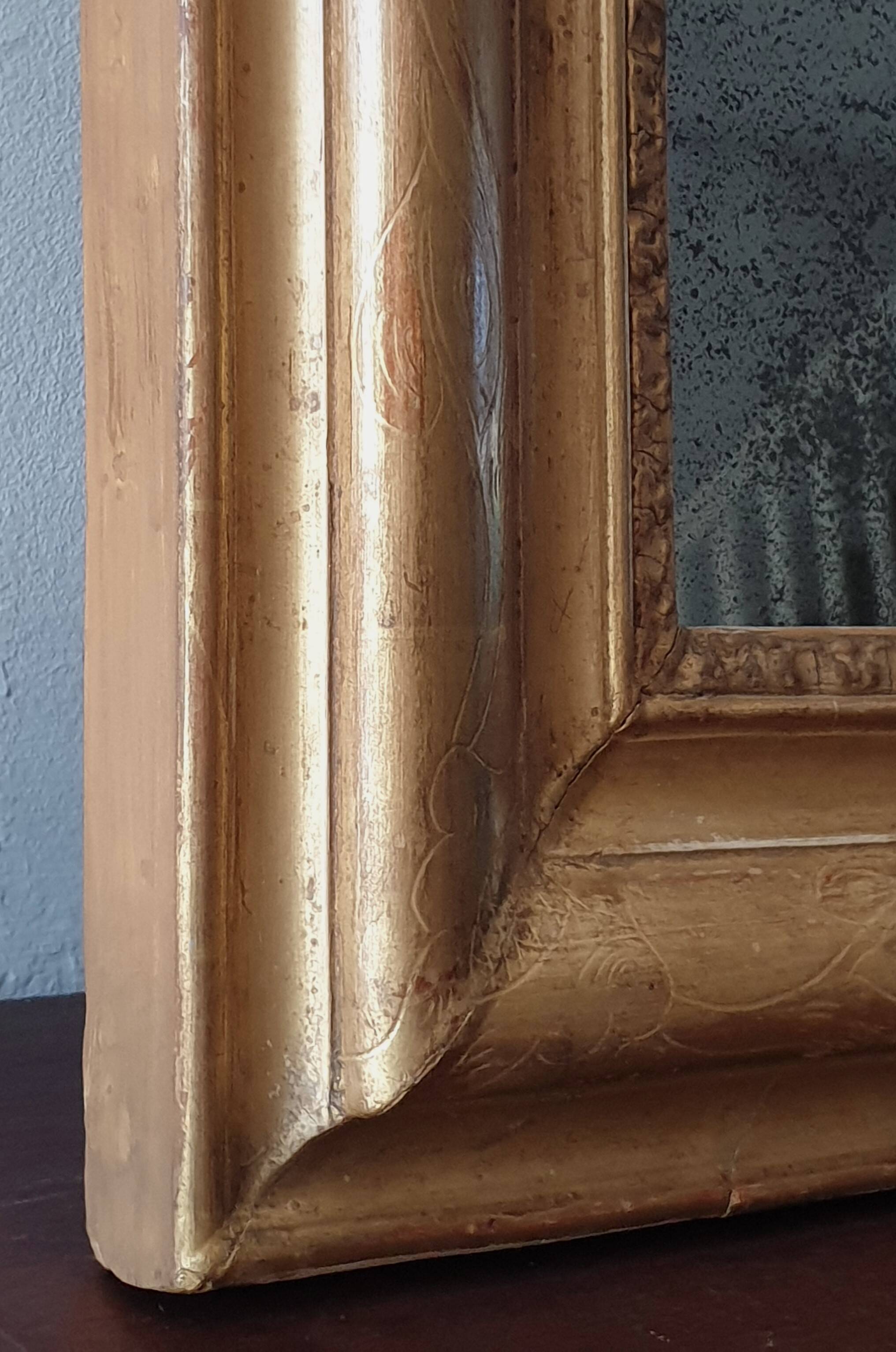 Old gilded mirror and old mercury glass - wall mirror with gold leaf