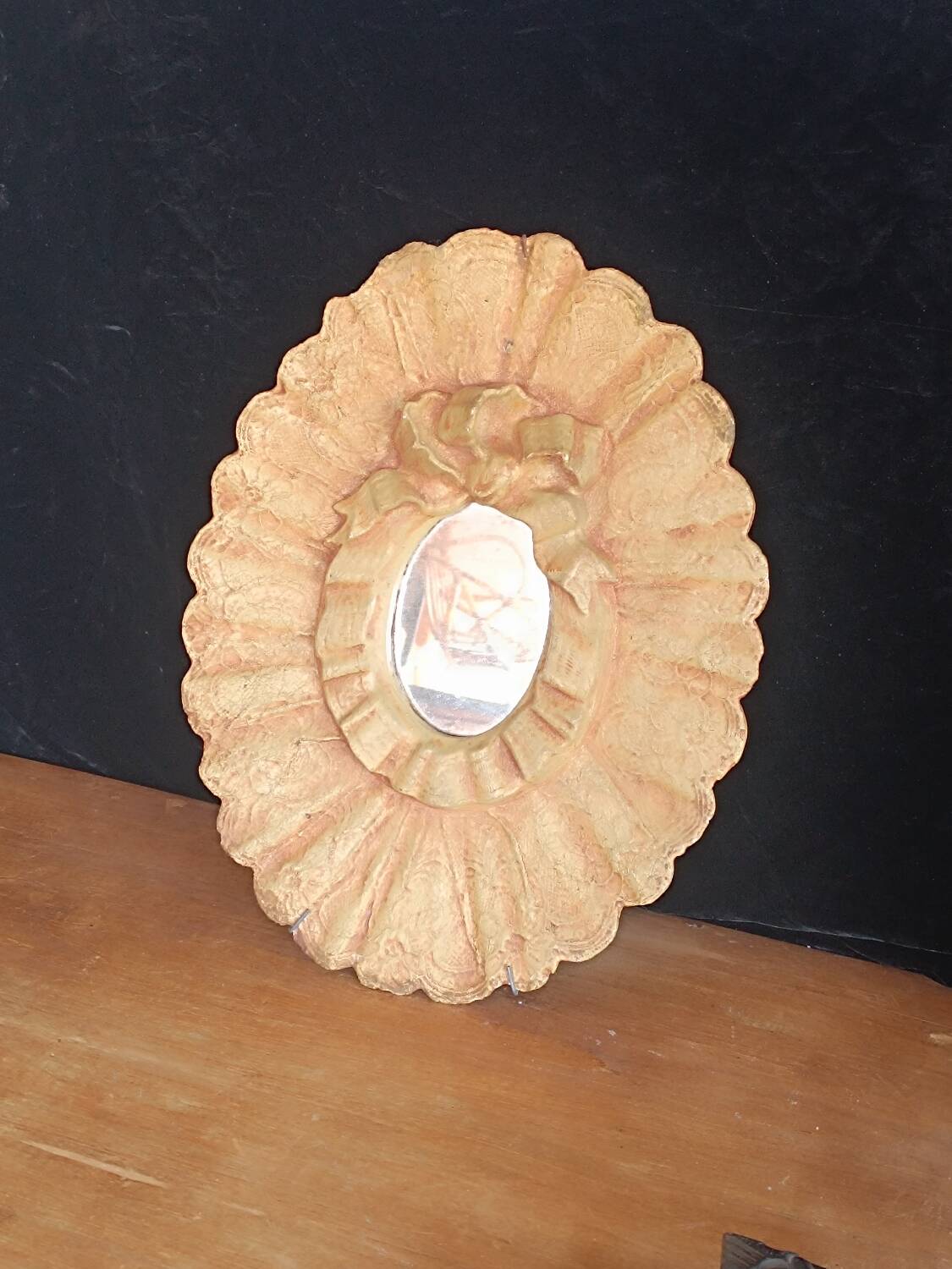 Painted oval plaster mirror