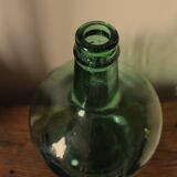 Dame Jeanne carboy from the Viresa collection in dark green glass