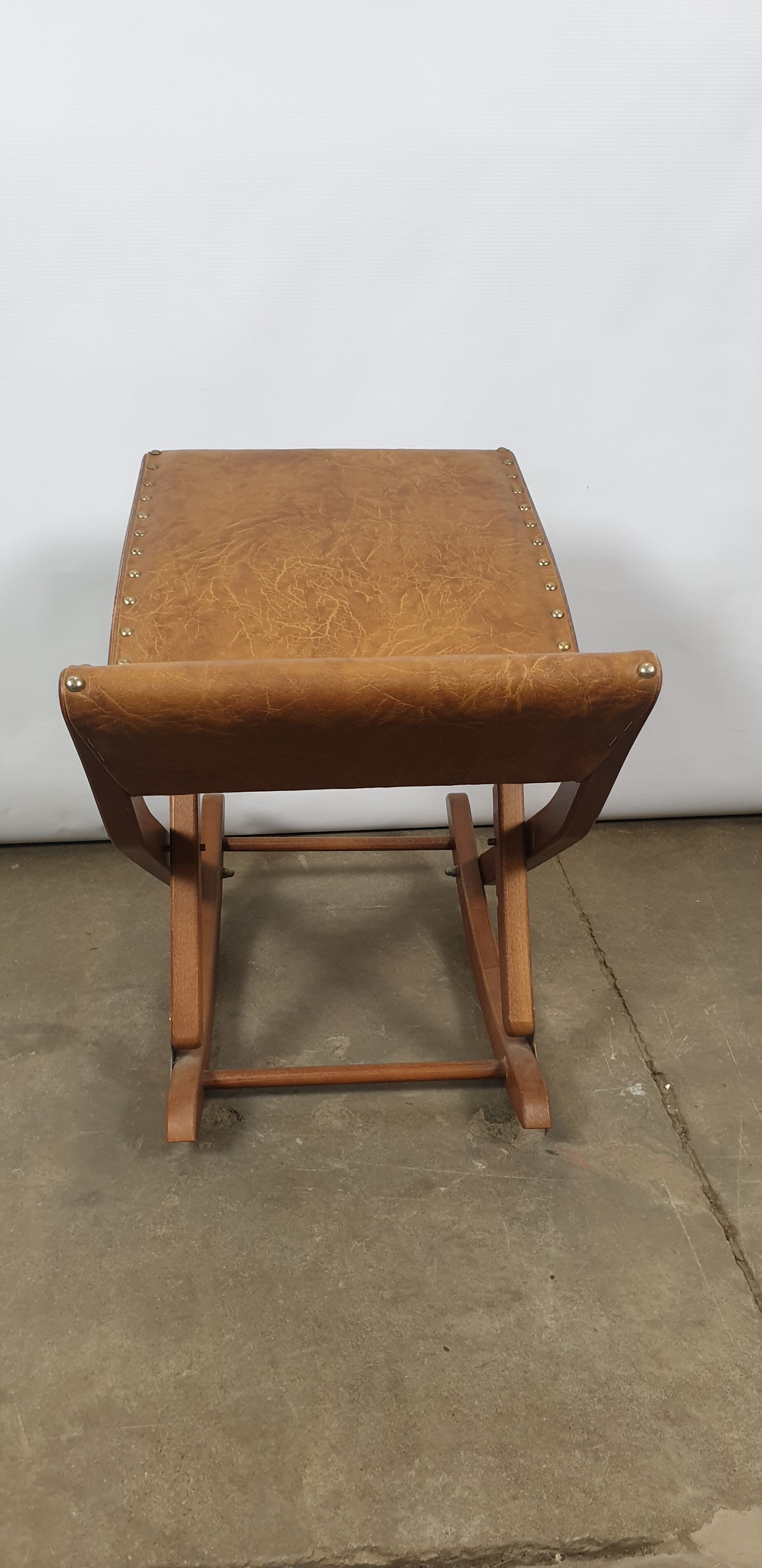 Wooden and leather folding rocking footring