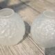 Art Deco ball vase pair with flower and leaf decor