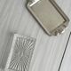 Metal butter dish and thick rectangular glass bowl.