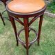 Pair of curved wooden bistro stools with leather seats