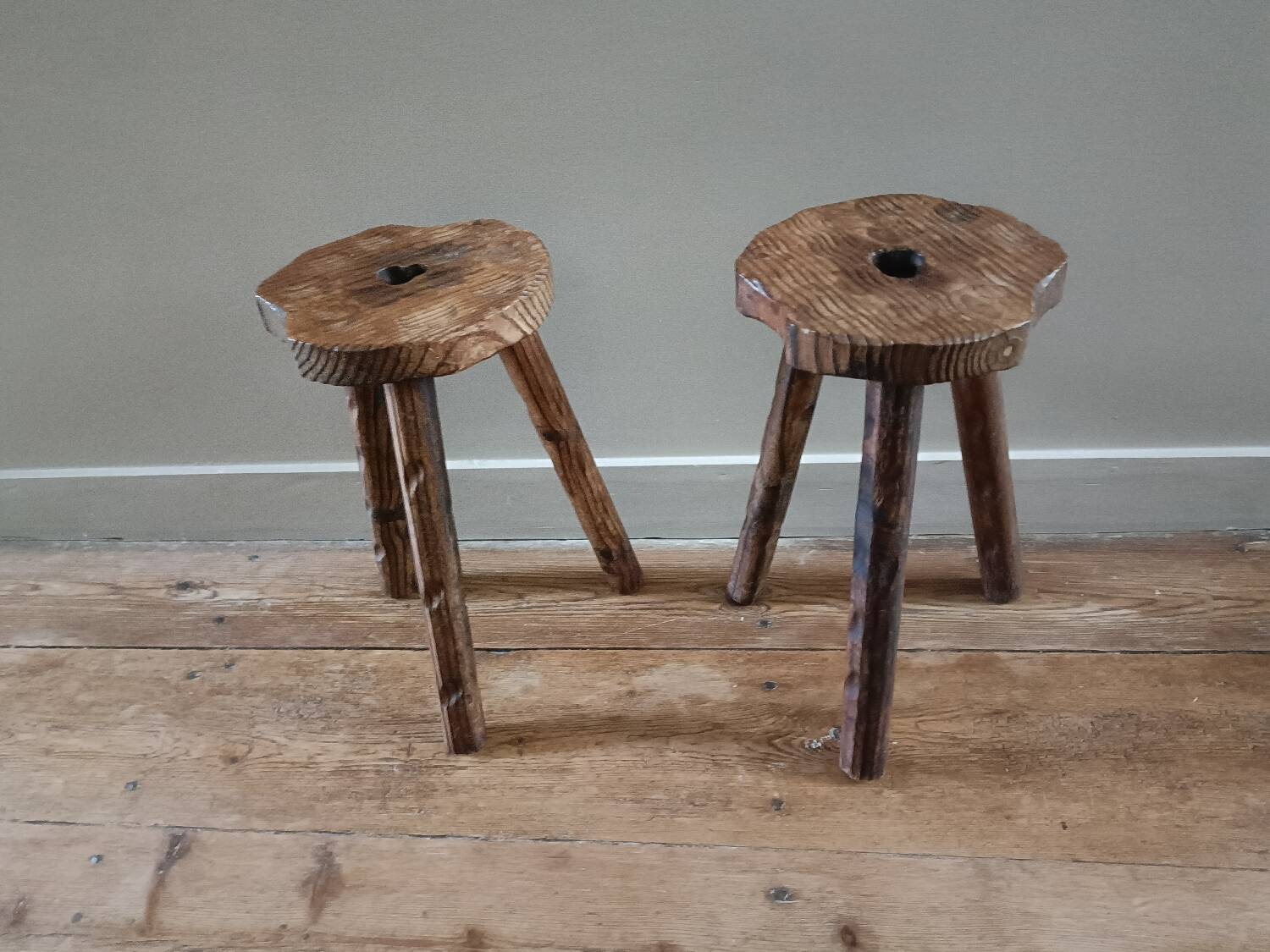 A pair of tripod stools