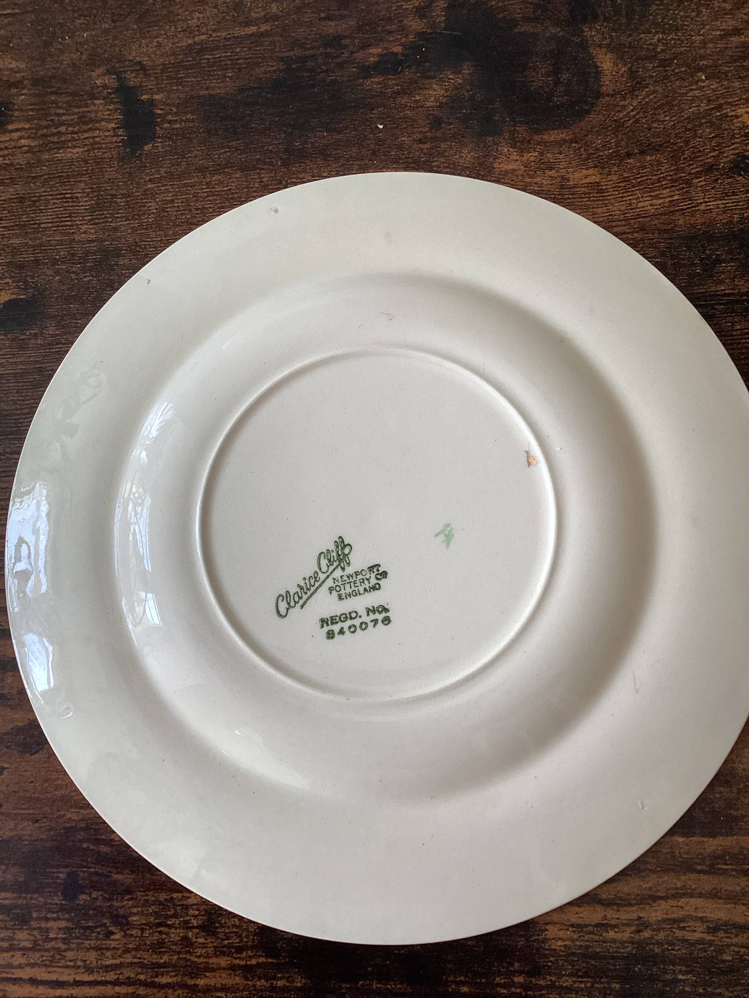 Two identical vintage Clarice Cliff plates from the Newport Pottery.