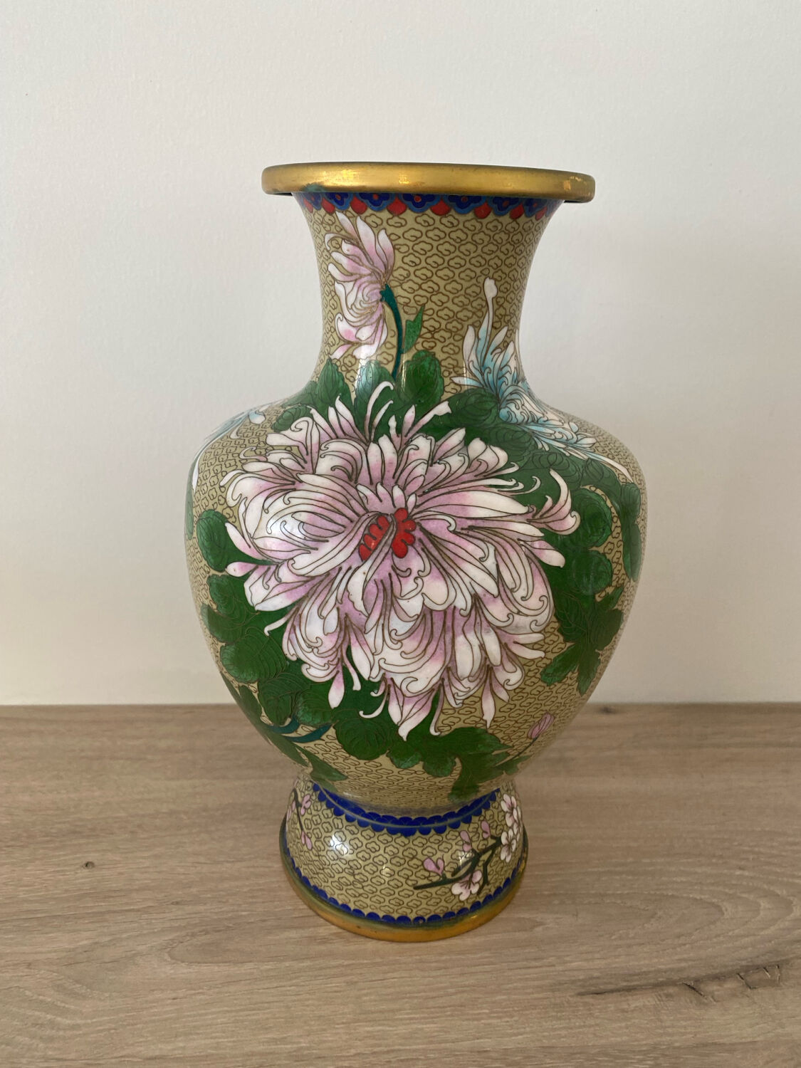 Chinese cloisonné vase decorated with flowers and butterflies.