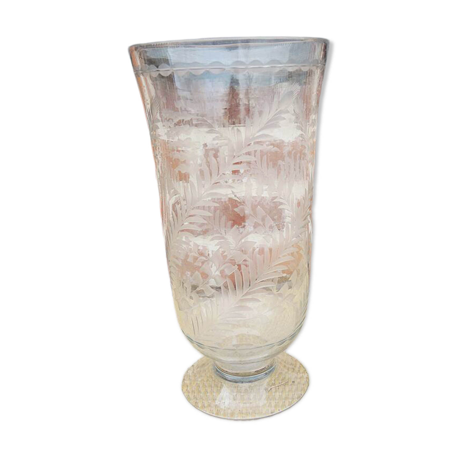 Ancient transparent glass vase with engraved plant decoration.