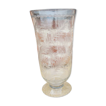 Ancient transparent glass vase with engraved plant decoration.