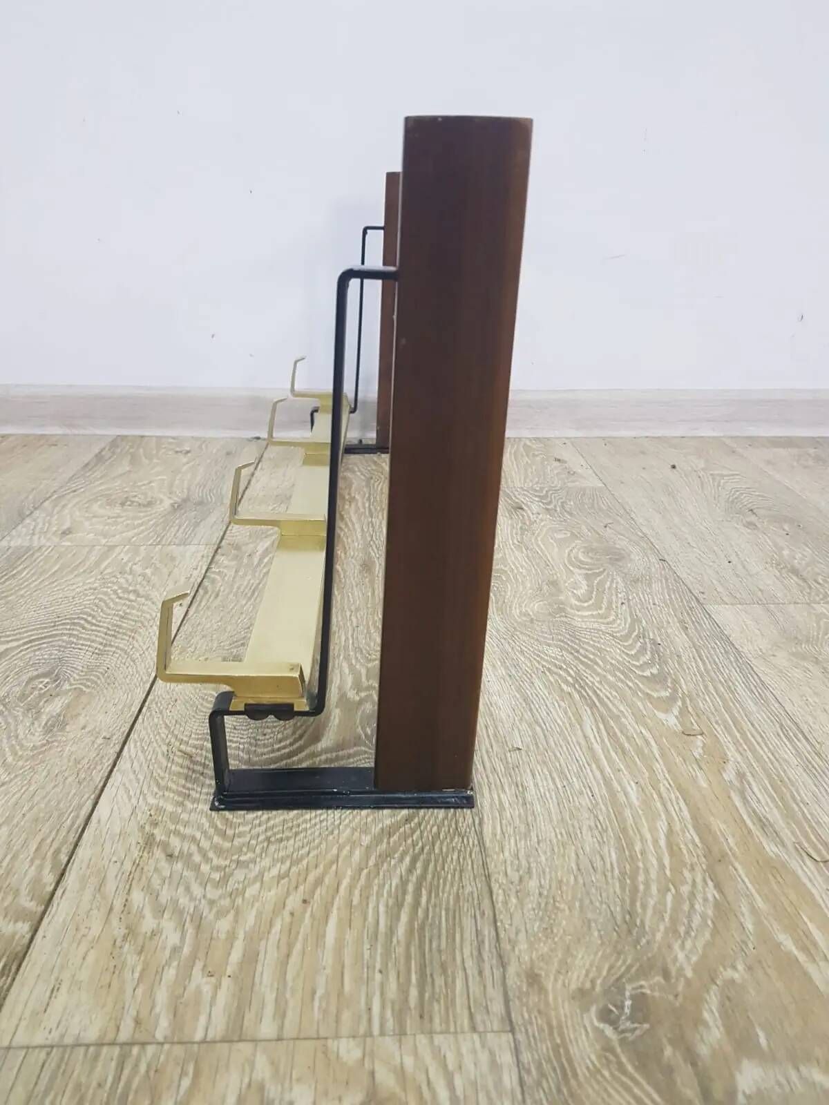 Wall-mounted coat rack, rosewood, gold-tone brass, Austria, 1960s.