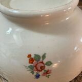 Flowery bowl with blue edging.