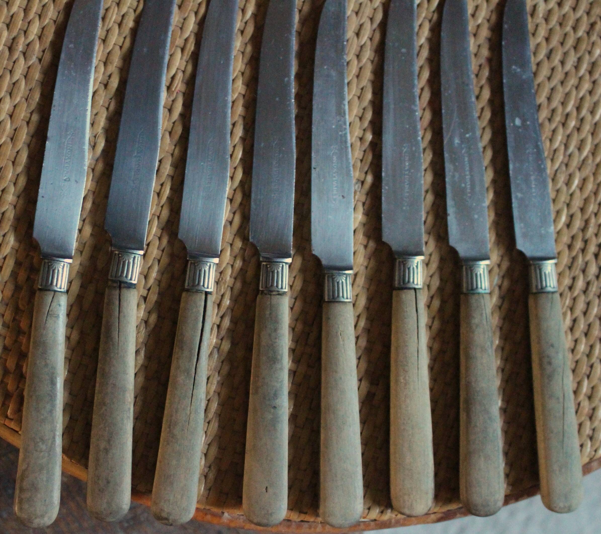 Lot of 8 antique knives with wooden handles.