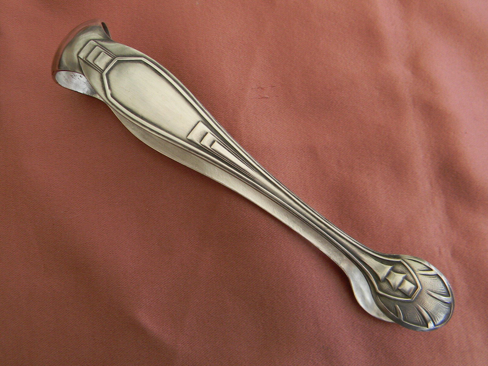Art deco sugar tongs in silver metal