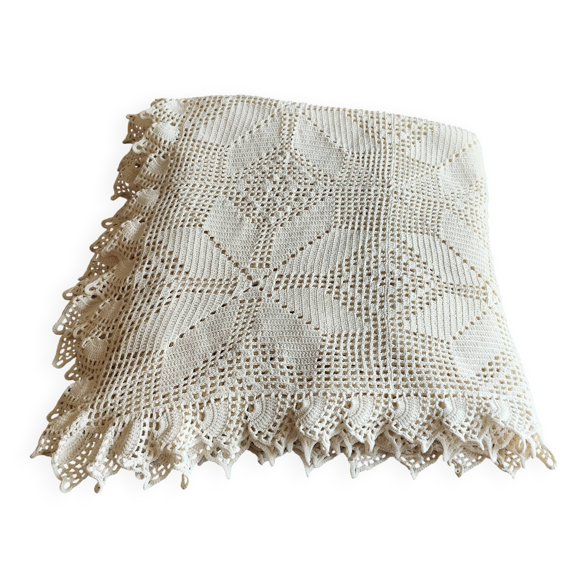 White cotton bedspread, crocheted sofa throw with star patterns