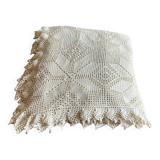 White cotton bedspread, crocheted sofa throw with star patterns