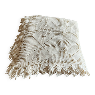 White cotton bedspread, crocheted sofa throw with star patterns