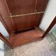 Antique wooden coat rack with mirror and shelf.