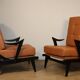 Paire de fauteuils vintage années 50 en bois noir et cuir caramel
