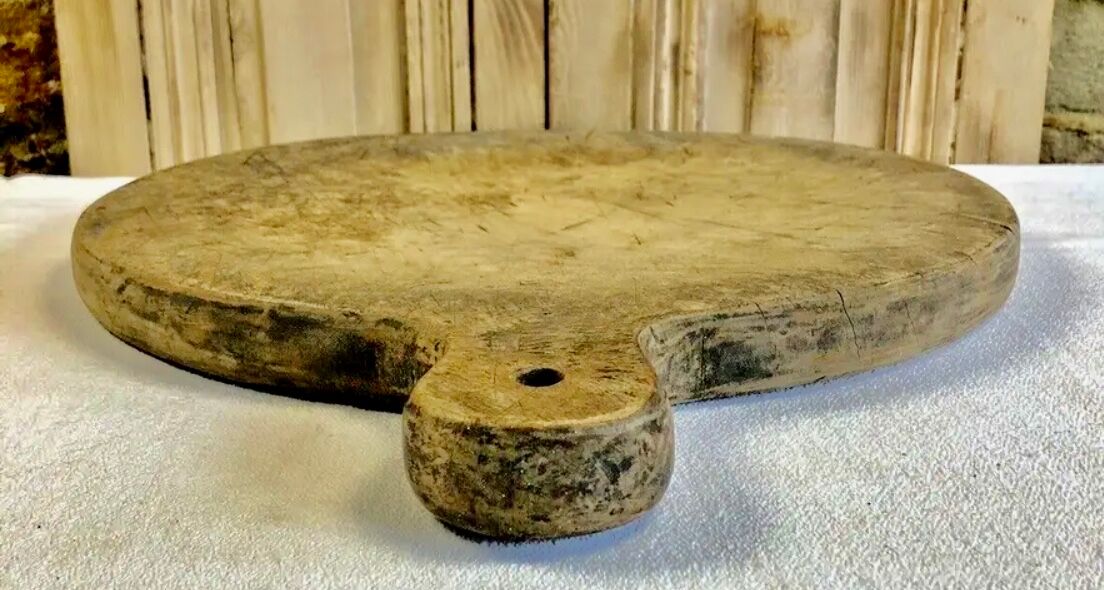 Old large round pizza cutting board