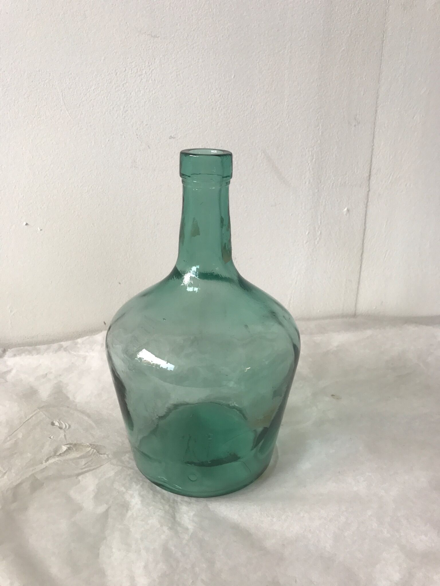 Dame jeanne en verre vert d'eau