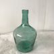 Dame jeanne en verre vert d'eau