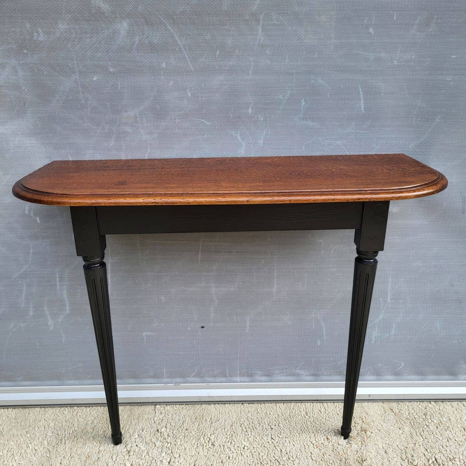 Console bicolore noire et chêne style Louis XVI restaurée