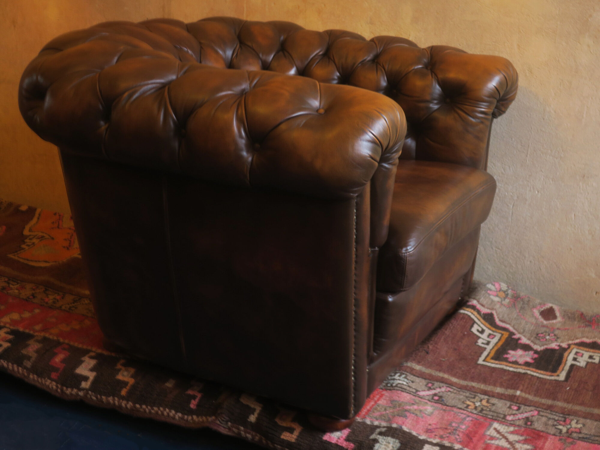 Chesterfield club armchair in patinated chestnut coloured leather