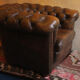 Chesterfield club armchair in patinated chestnut coloured leather