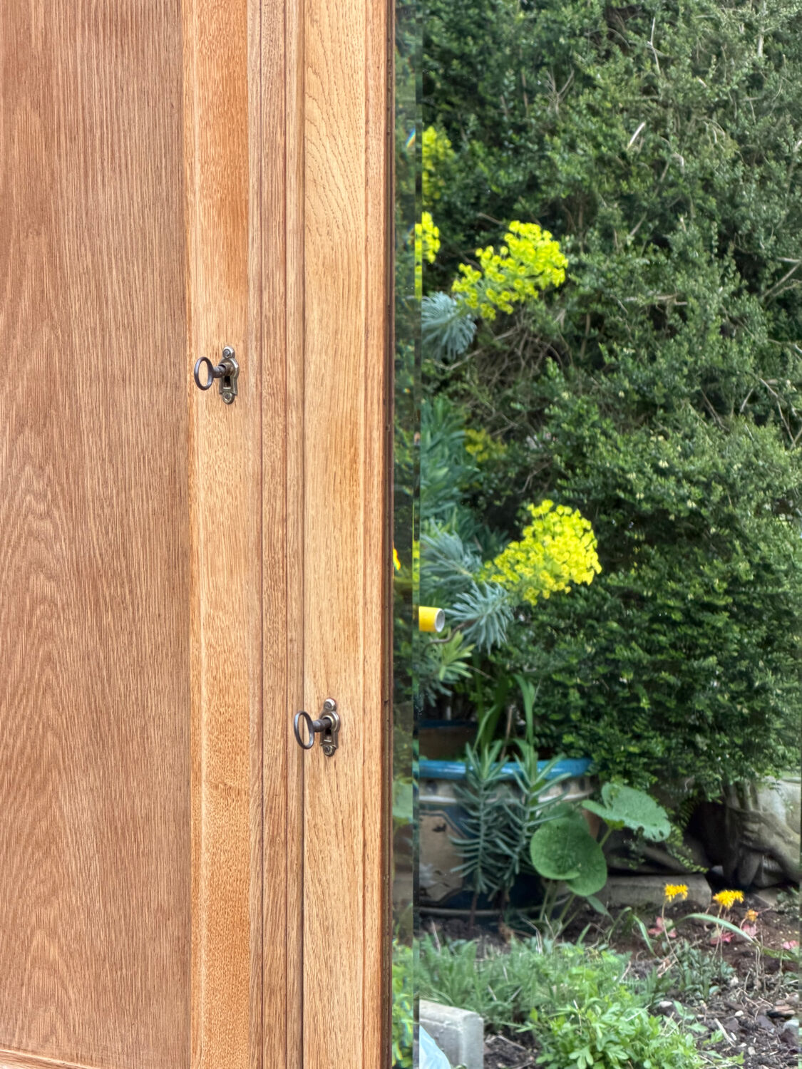 Parisian hotel wardrobe with bevelled mirror, solid raw oak, 1920.