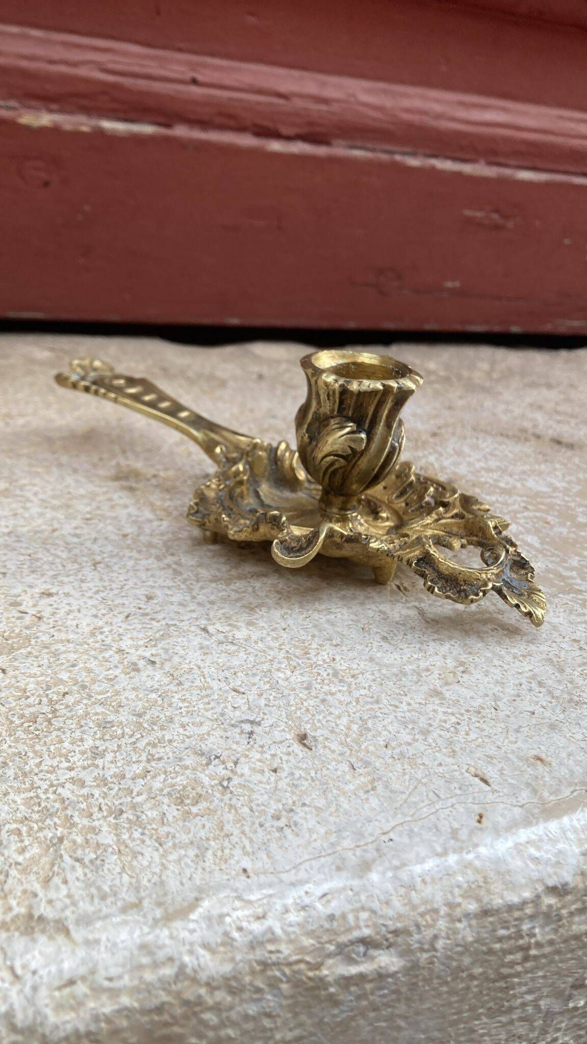 Pair of hand candlesticks / bronze candle holders