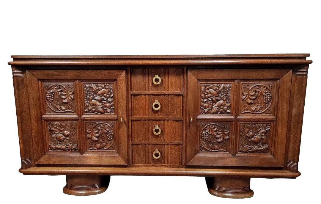 According to Charles Dudouyt: sideboard in a row in solid oak.