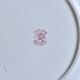 Round plate from the 19th century, pink ironstone, signed Maestricht "Toulouse"