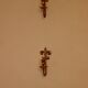 A pair of antique brass wall sconces.